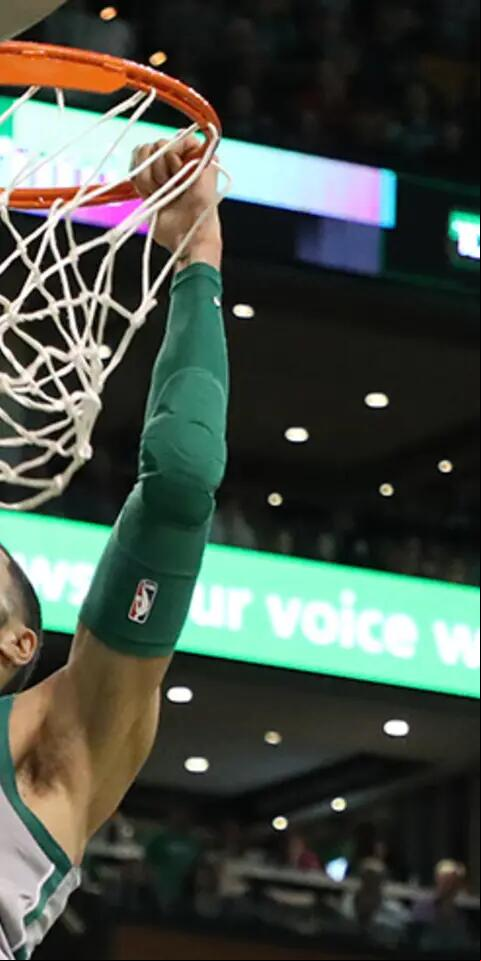 Boston Celtics' Jayson Tatum slam dunks against the Atlanta Hawks during the third quarter. The Boston Celtics host the Atlanta Hawks in a regular season NBA basketball game at TD Garden in Boston on April 8, 2018.