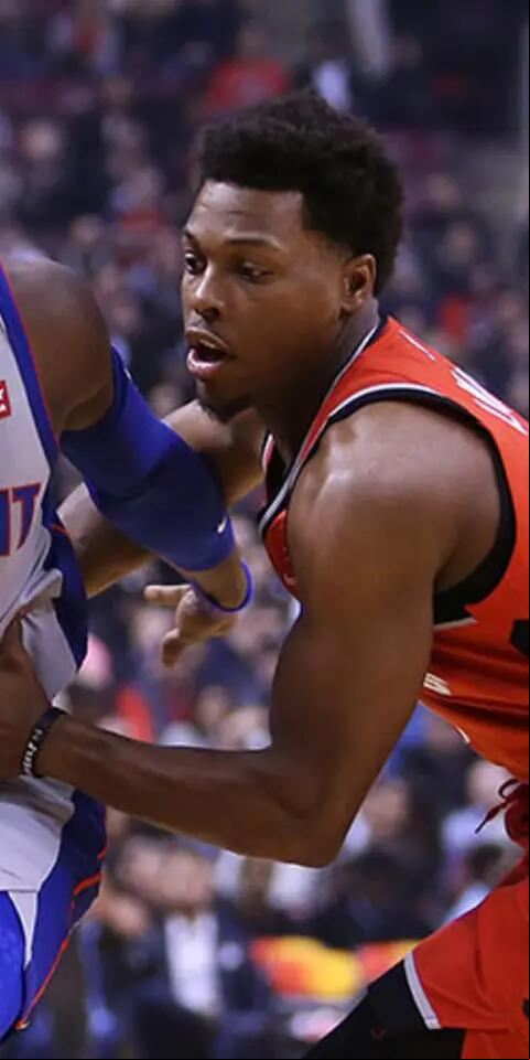 Reggie Jackson #1 of the Detroit Pistons dribbles the ball as Kyle Lowry #7 of the Toronto Raptors defends during the first half of an NBA game at Scotiabank Arena on November 14, 2018 in Toronto, Canada